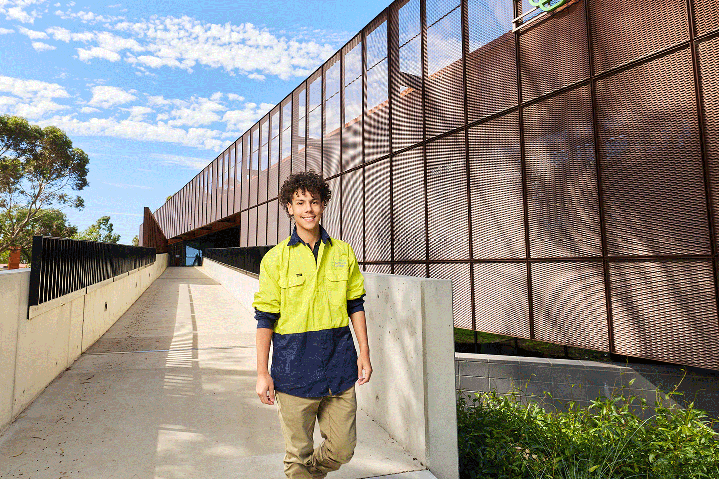 Tech College student walking through the facilities