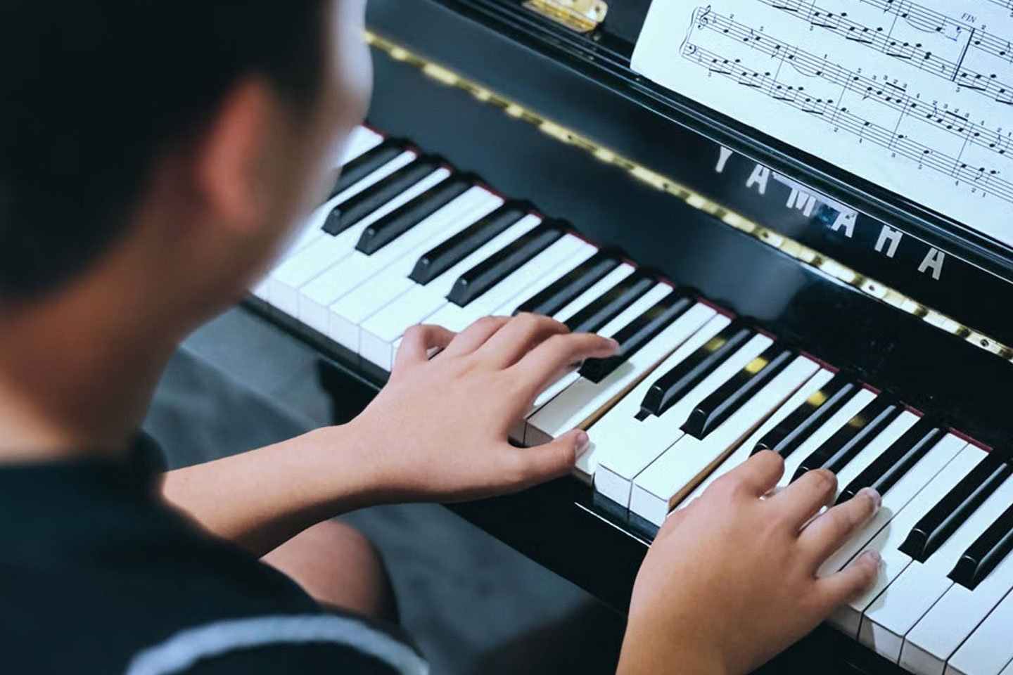 Student playing piano