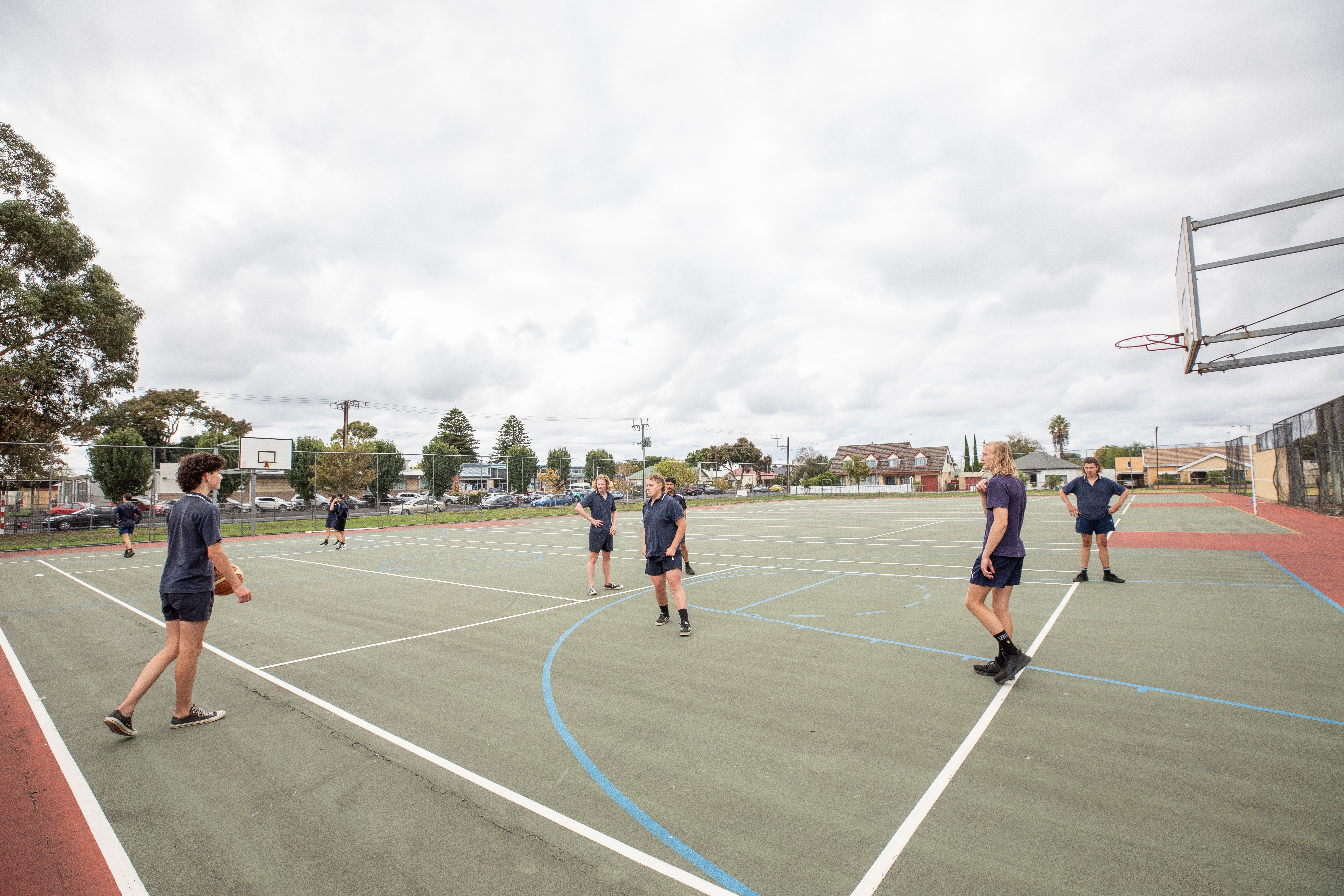 High school students playing basketball