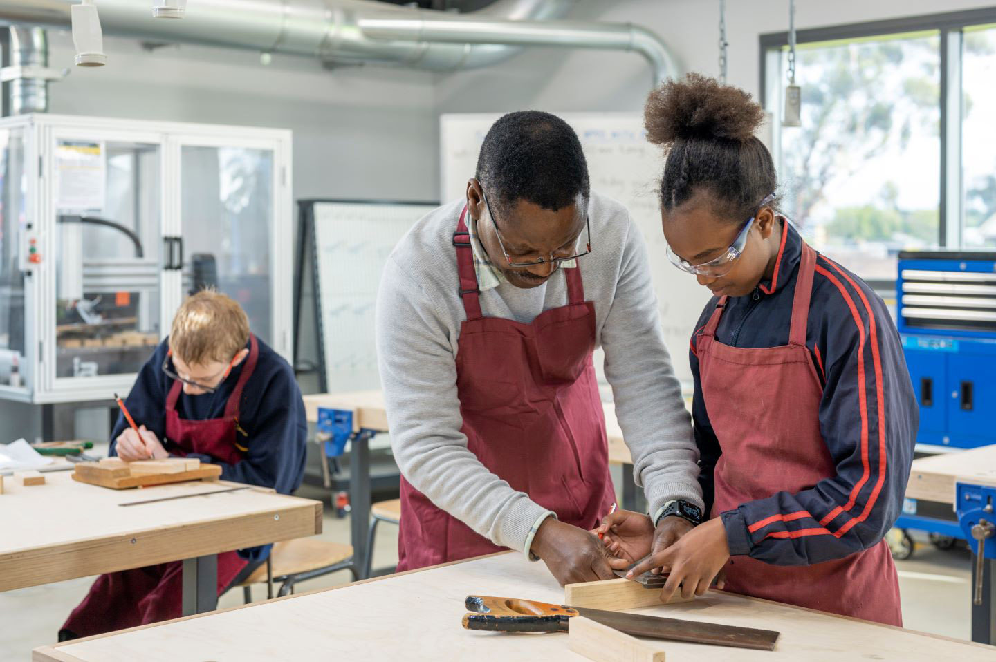 A teacher and student working together in class 