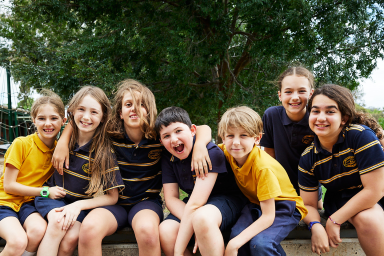 Photo of group of OSHC students together posing for photo outside