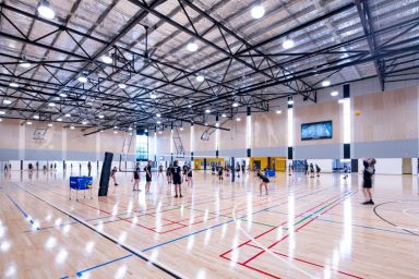 Indoor courts, school, children playing sport 