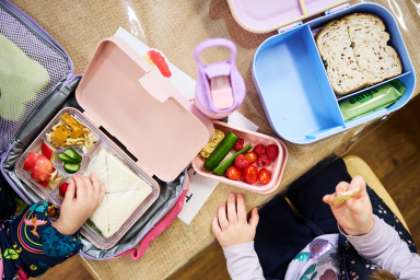 Photo of lunch boxes with healthy snacks