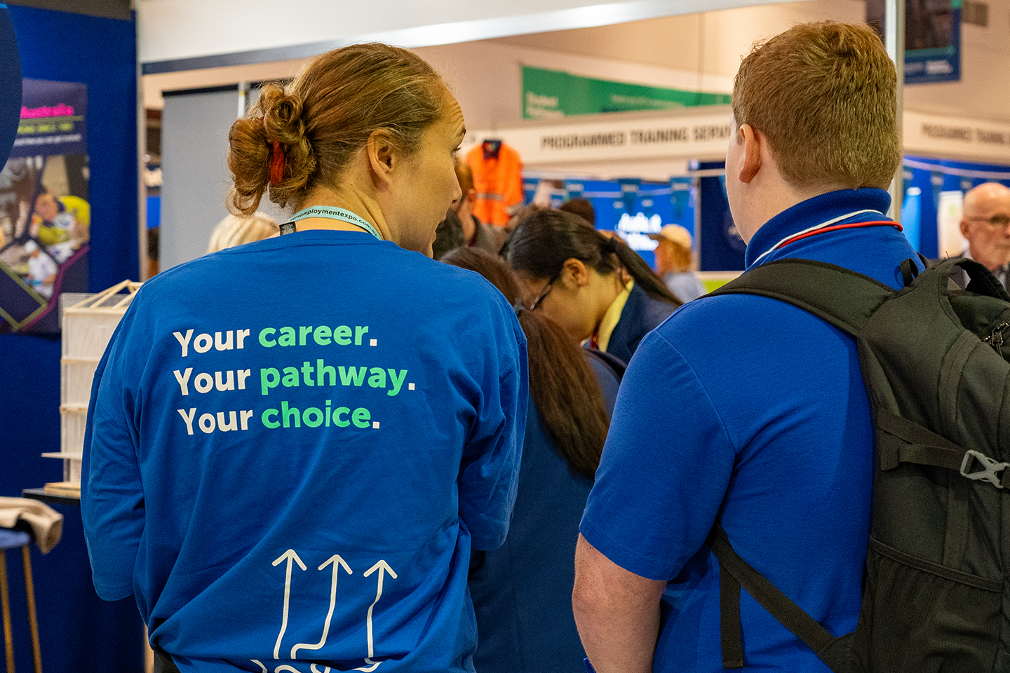 Photo of two people wearing student pathways t-shirts
