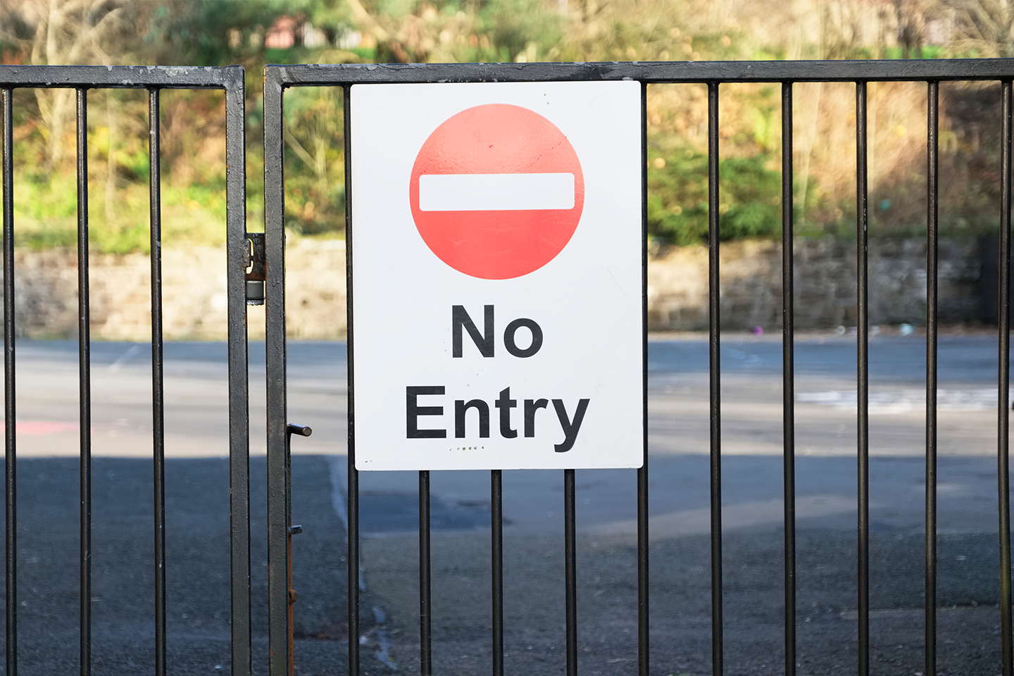 Photo of school fence with sign saying, 'No entry'