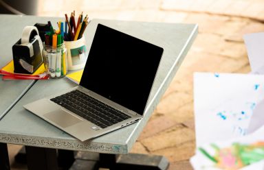 An open laptop placed on a desk. 