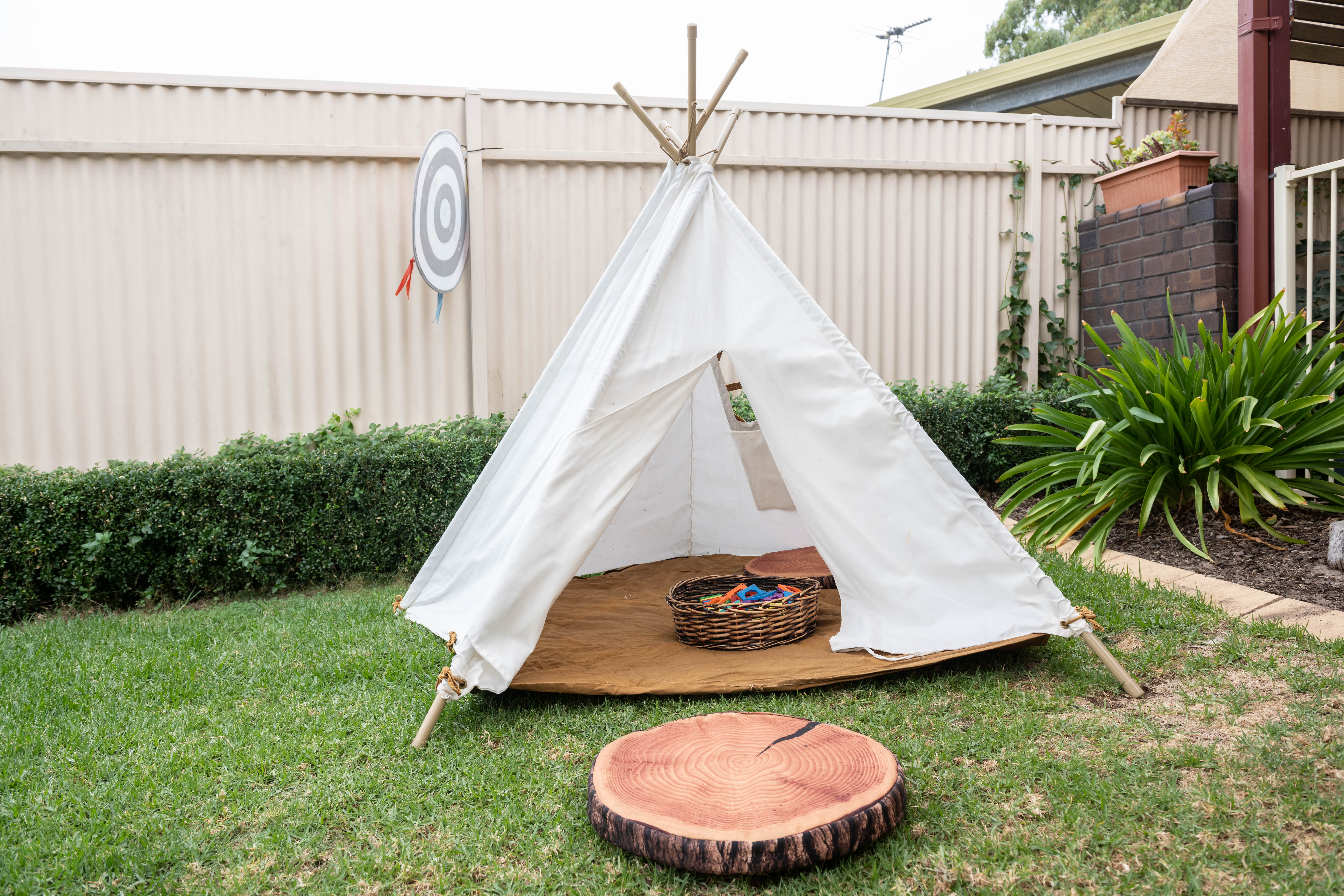 family day care setting – outside teepee play tent on grass