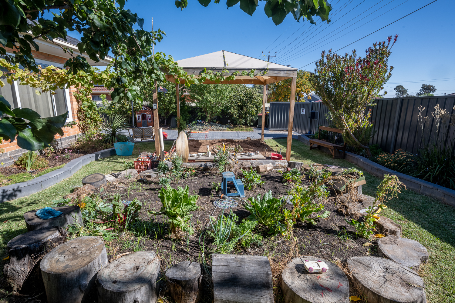 family day care setting – backyard with large outdoor vegetable patch