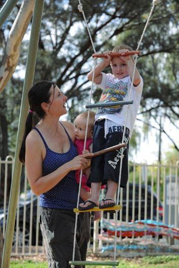 Child climbing on playground ladder