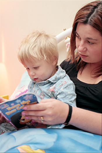 Mother reading to her son