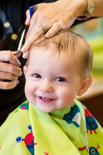 Young child getting there hair cut