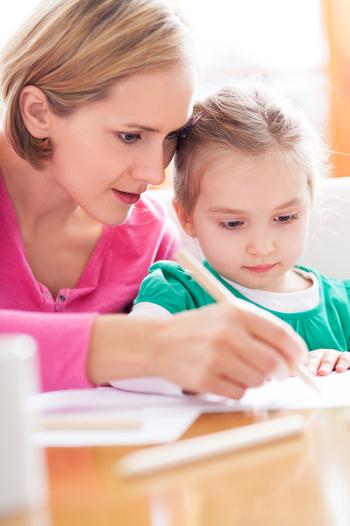 Mother and daughter paying a bill together