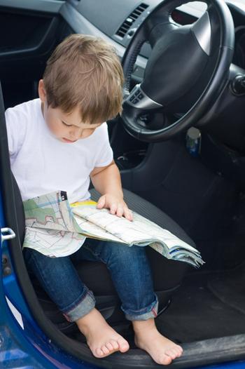 Toddler reading a map