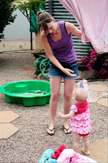 Mother and daughter sorting out the washing