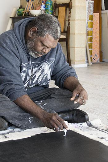 Aboriginal man painting 