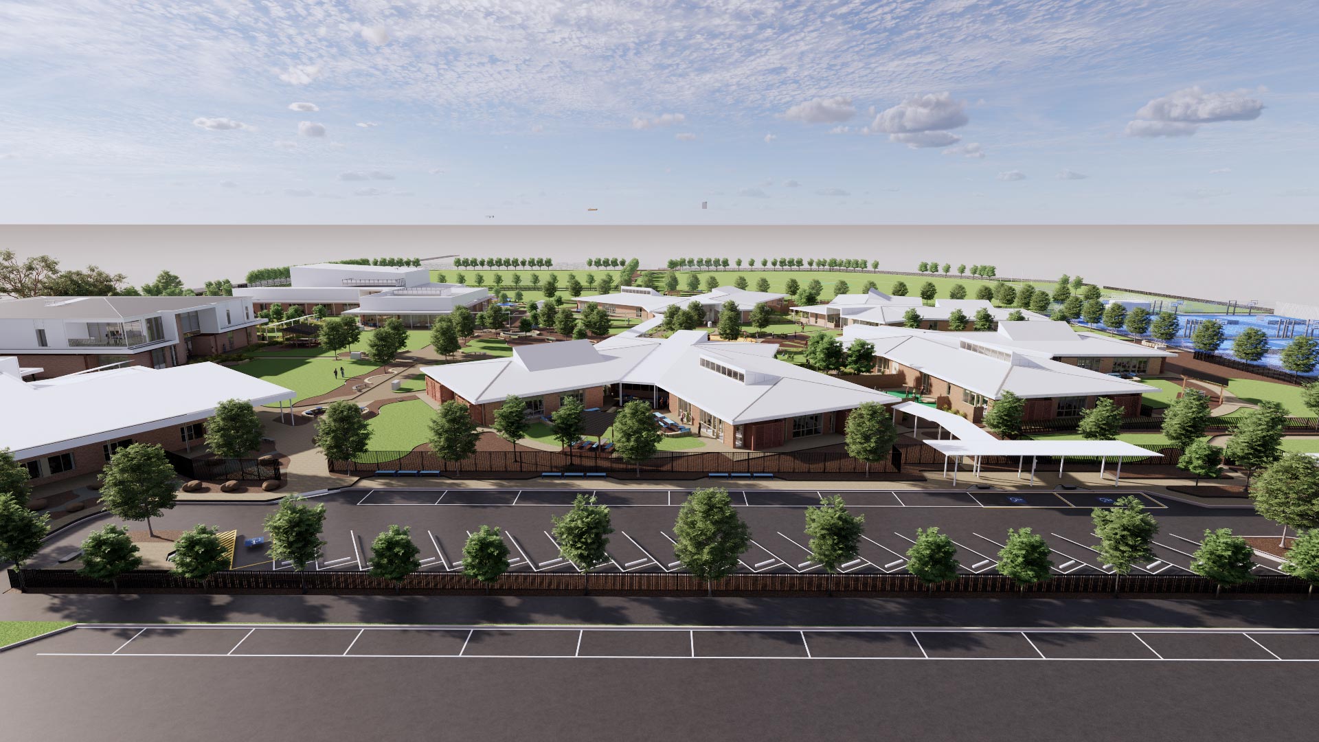 Render of the aerial view from Pemberthen Road over the new school campus, overlooking the carpark and multiple buildings surrounded by green spaces and trees