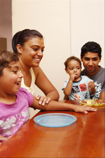 Family sitting at the dining room table