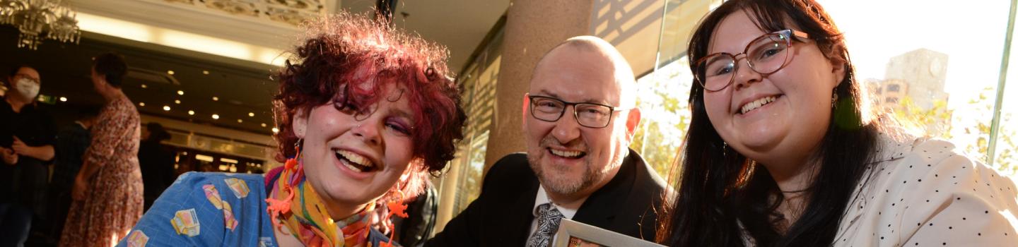 Two students accept their Reconciliation Week awards from Chief Executive Martin Westwell