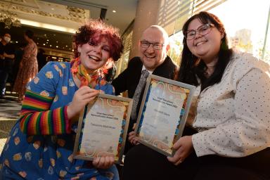 Two students accept their Reconciliation Week awards from Chief Executive Martin Westwell