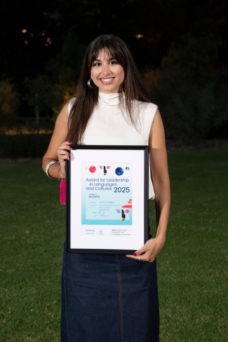 Woman holding award