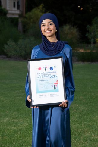 woman holding award
