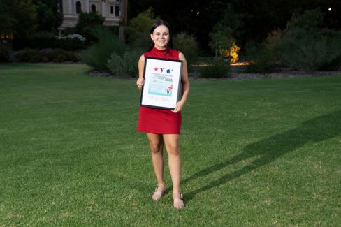 woman holding an award