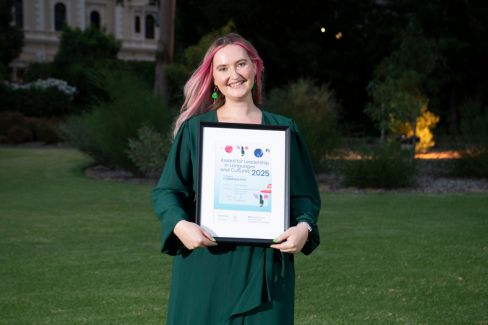 woman holding an award