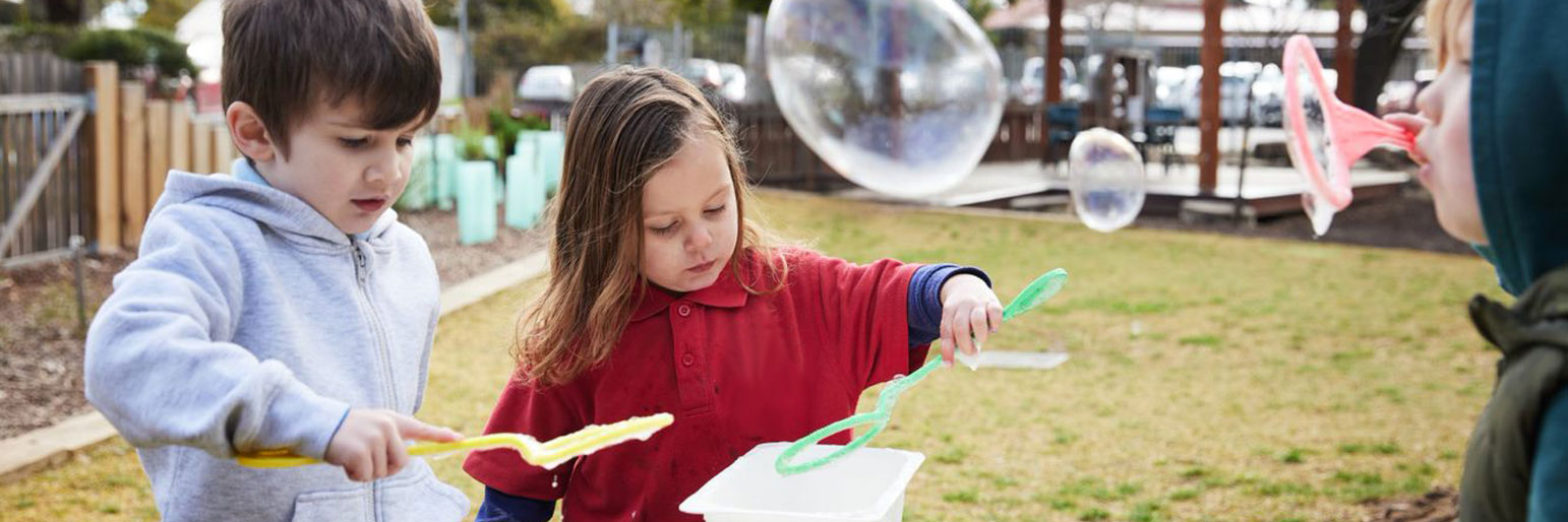 children playing with bubbles